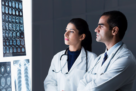 Doctors analysing scans to understand brain health in India and the relation between the brain and ageing.