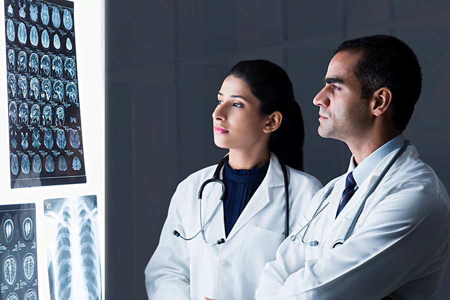 Doctors analysing scans to understand brain health in India and the relation between the brain and ageing.